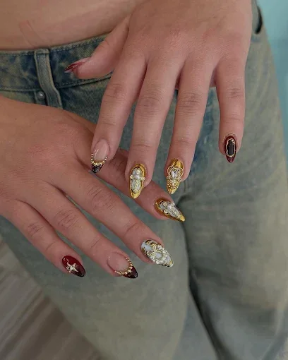 Golden details nail art at ESTI Nails Studio